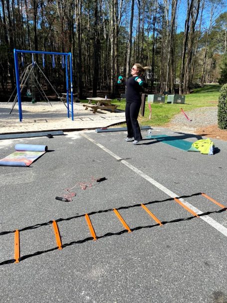 Outdoor workout with fitness trainer